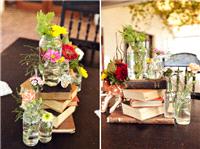 Wildflowers in jars on old books